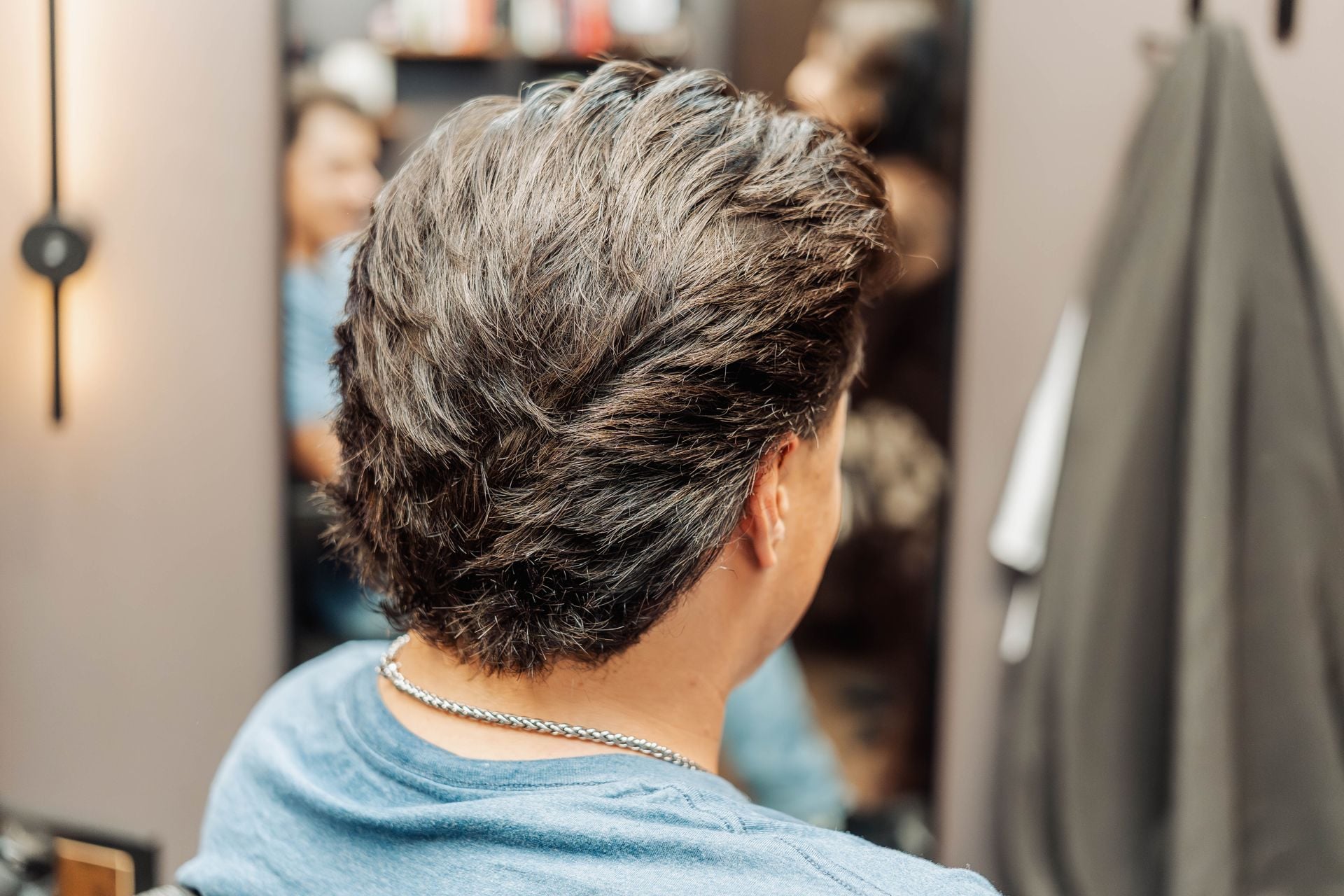 Gentleman with a finished haircut and beard trim at The Speakeasy Barber, Austin
