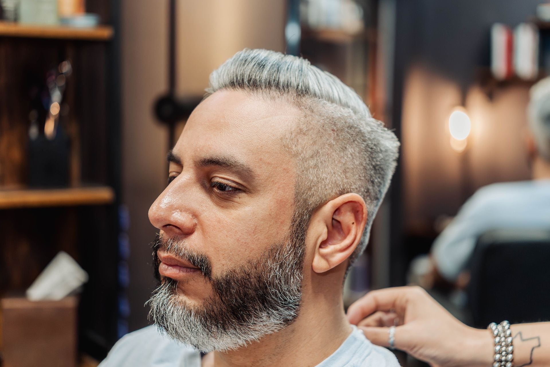 Client with a finished haircut and mustache trim at The Speakeasy Barber, Austin