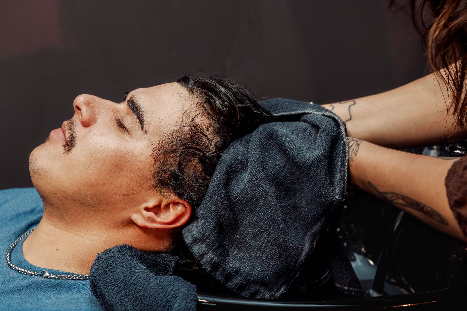 Client mid-haircut with grey blending at The Speakeasy Barber in Austin