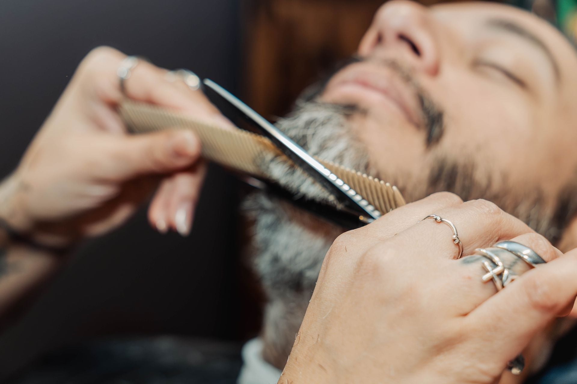 Straight razor and comb detail work on a client's beard at The Speakeasy Barber